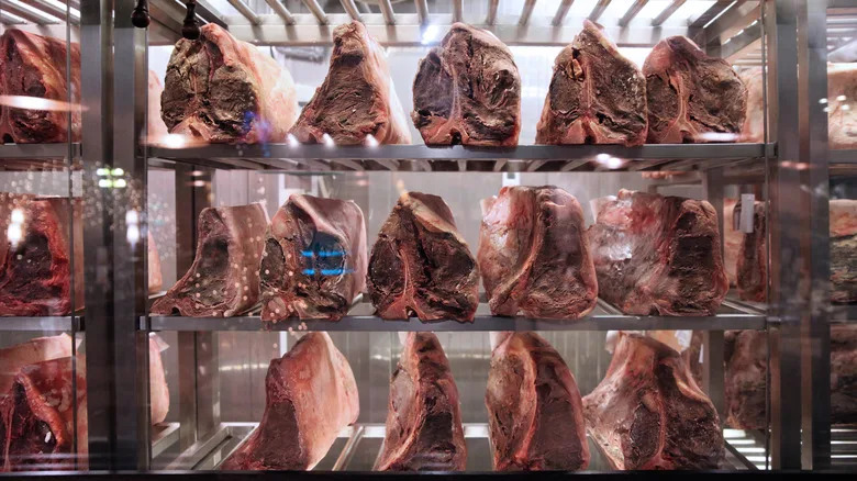 Portions of beef dry-aging in controlled environment