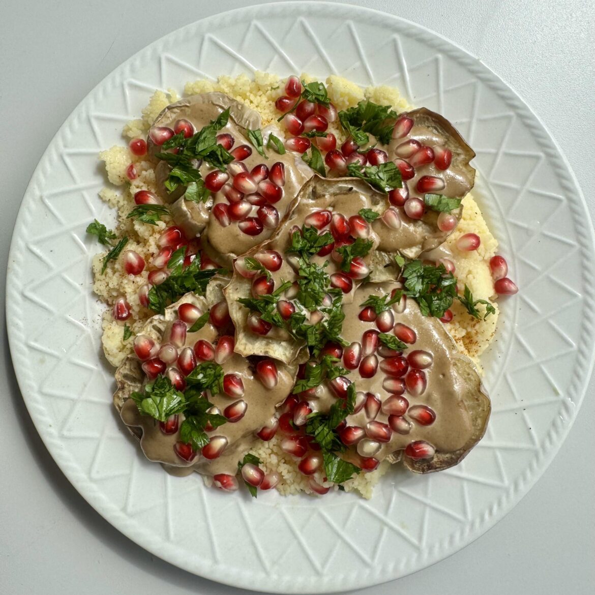 Roasted eggplant with tahini and pomegranate