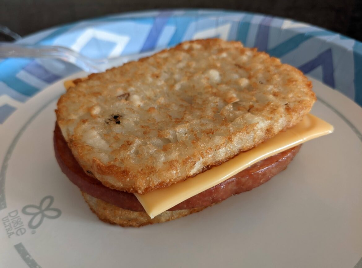 Fried SPAM and cheese between two hash browns