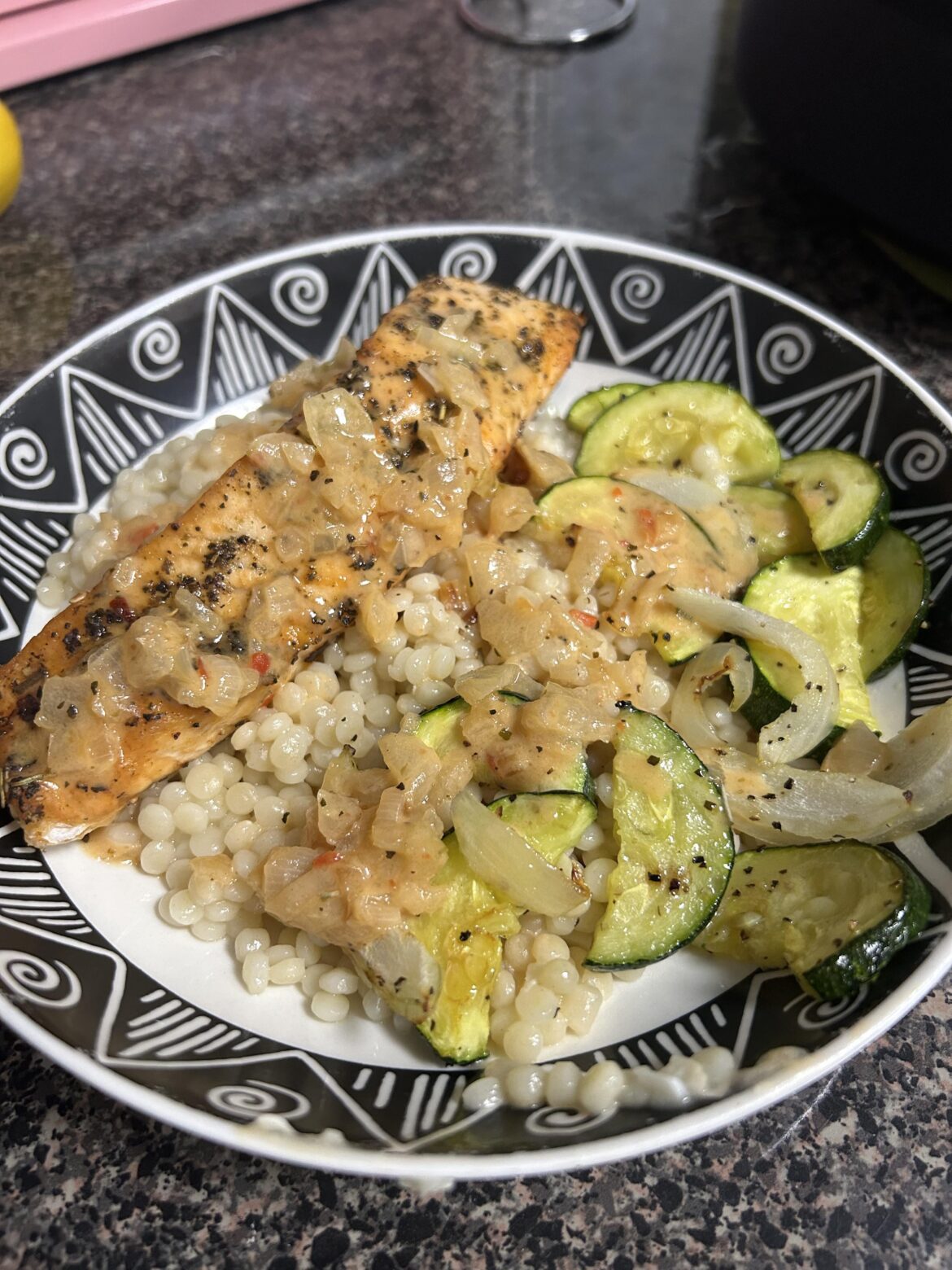 Herby salmon with red pepper cream sauce