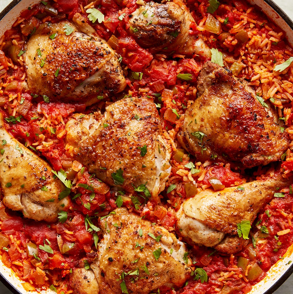 chicken thighs and legs in a tomato based rice