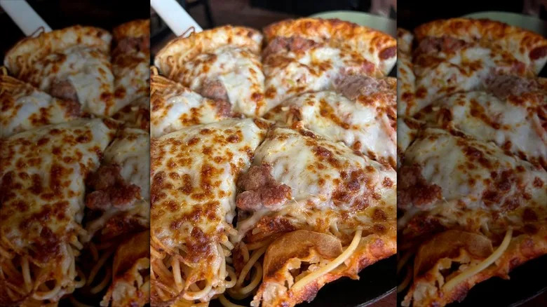 Illinois spaghetti pizza on platter closeup.