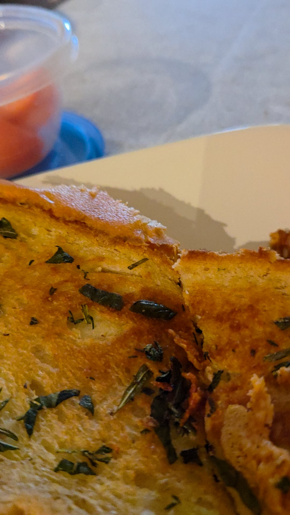 Comfort meal! Grocery store sourdough, garden herbs, 3 cheeses.