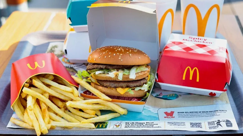 McDonald's tray with fries, sandwiches, and drinks