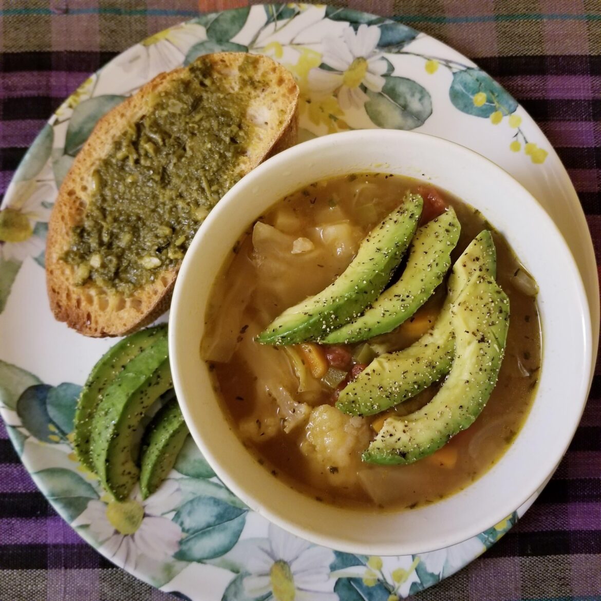 Today's Lunch: Cabbage Soup Topped With Sliced Avocado and a Side of Toasted Saloio Bread With a Schmear of Pesto Sauce ~ 350 Calories