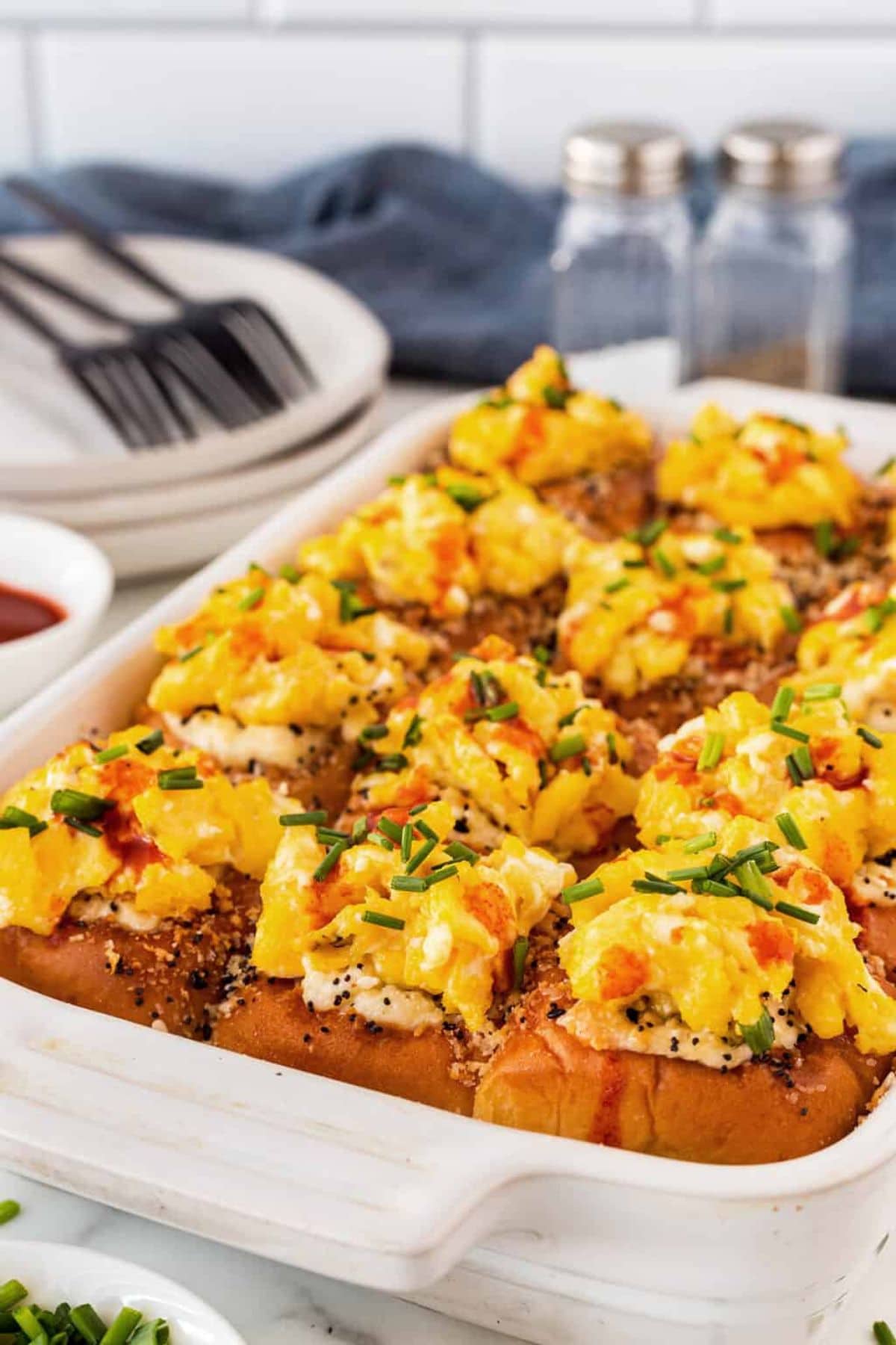 These 35 Scrumptious Make Ahead Brunch Casseroles will make your life over the holidays so much easier. Plus, everyone will be delighted with any one of these casseroles for the holidays. Bacon egg sliders in dish.