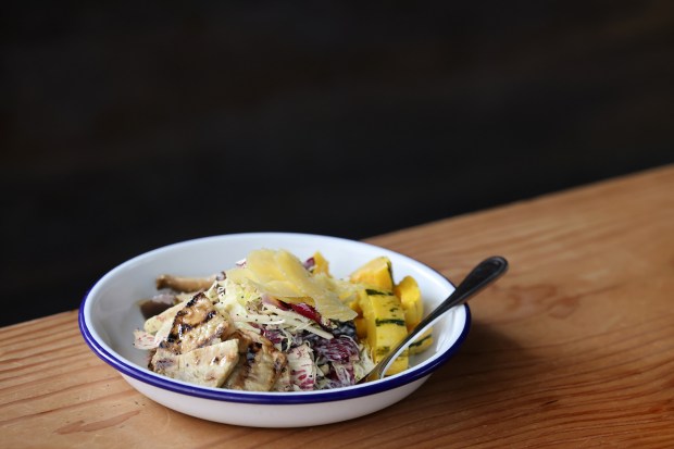 A “Roots and Shoots” bowl with sprouted lentils, roasted delicata...