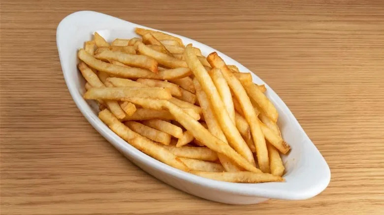 Zippy's French fries on wooden surface