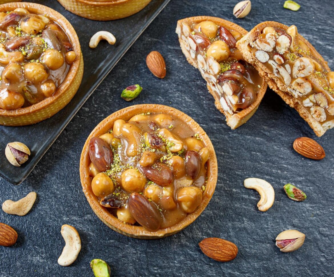 [Pro/Chef] The crust is classic Pâte Sablée, the filling - a mix of almonds, hazelnuts, cashews, pistachios, and a soft caramel.