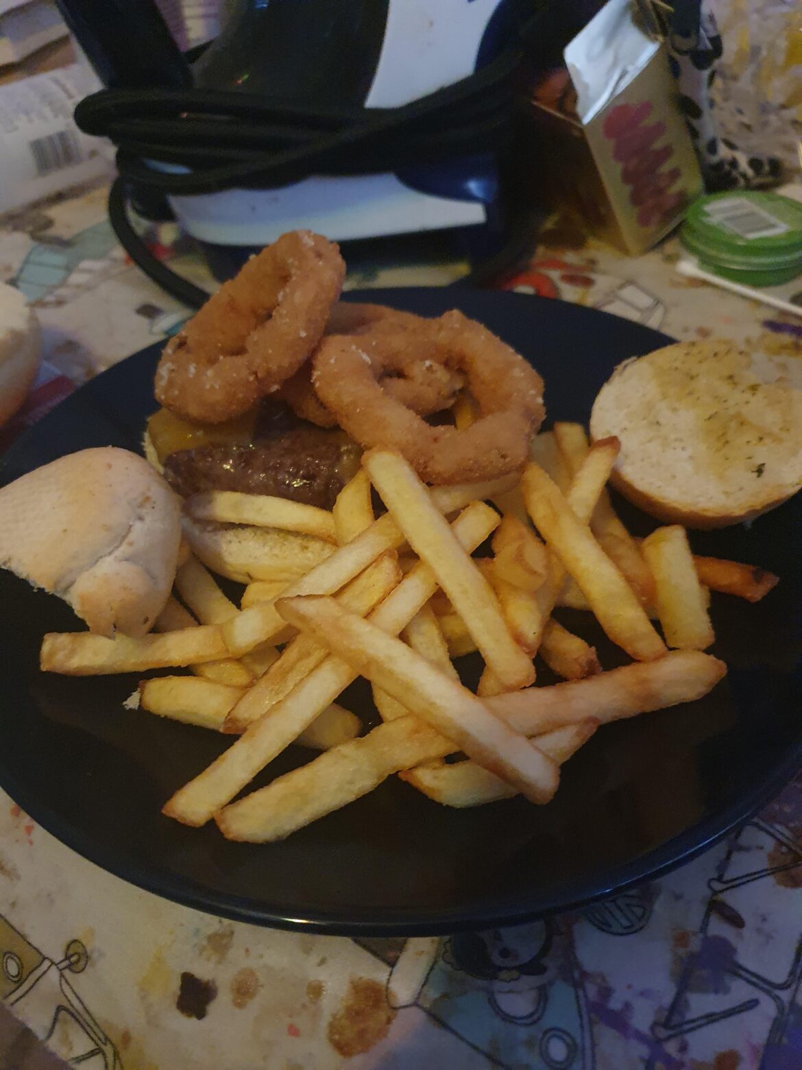 Cheeseburger onion rings French fries Tuesday dinner garlic bread