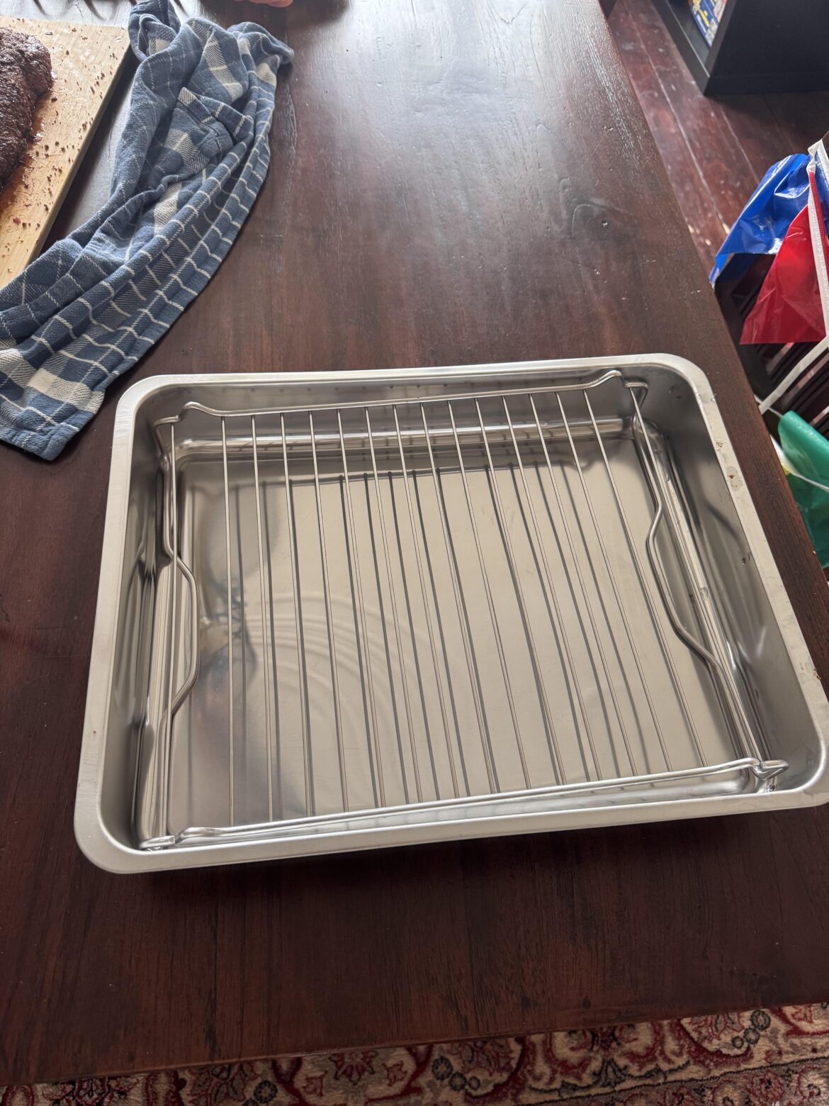 Will using a roasting pan with rack (to keep grill clean) impact smoke flavour?