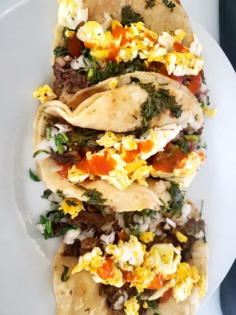 La Chiquita Mexican Market Reno, NV. 2 asada, 1 lengua, added scrambys, Sinanola ghost pepper sauce