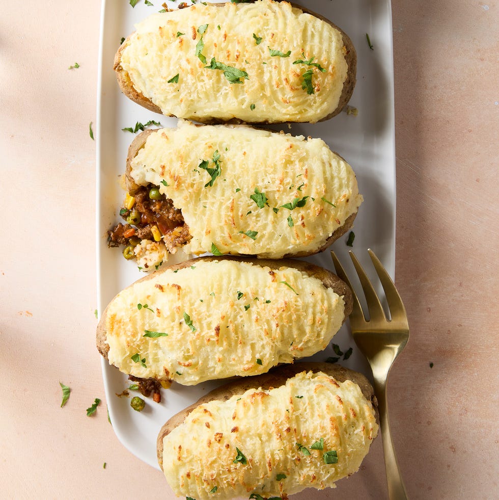 a saucy, red wine spiked ground beef and vegetable mixture gets loaded into hollowed out russet potatoes, topped with parmesan mashed potatoes, and baked until golden brown
