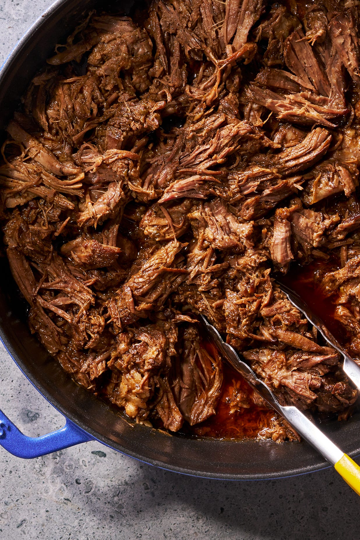 marbled beef chuck seasoned with chili powder and cumin then seared and braised in a beef broth flavored with chipotle chili sauce, scallion, garlic, and fresh herbs until fork tender