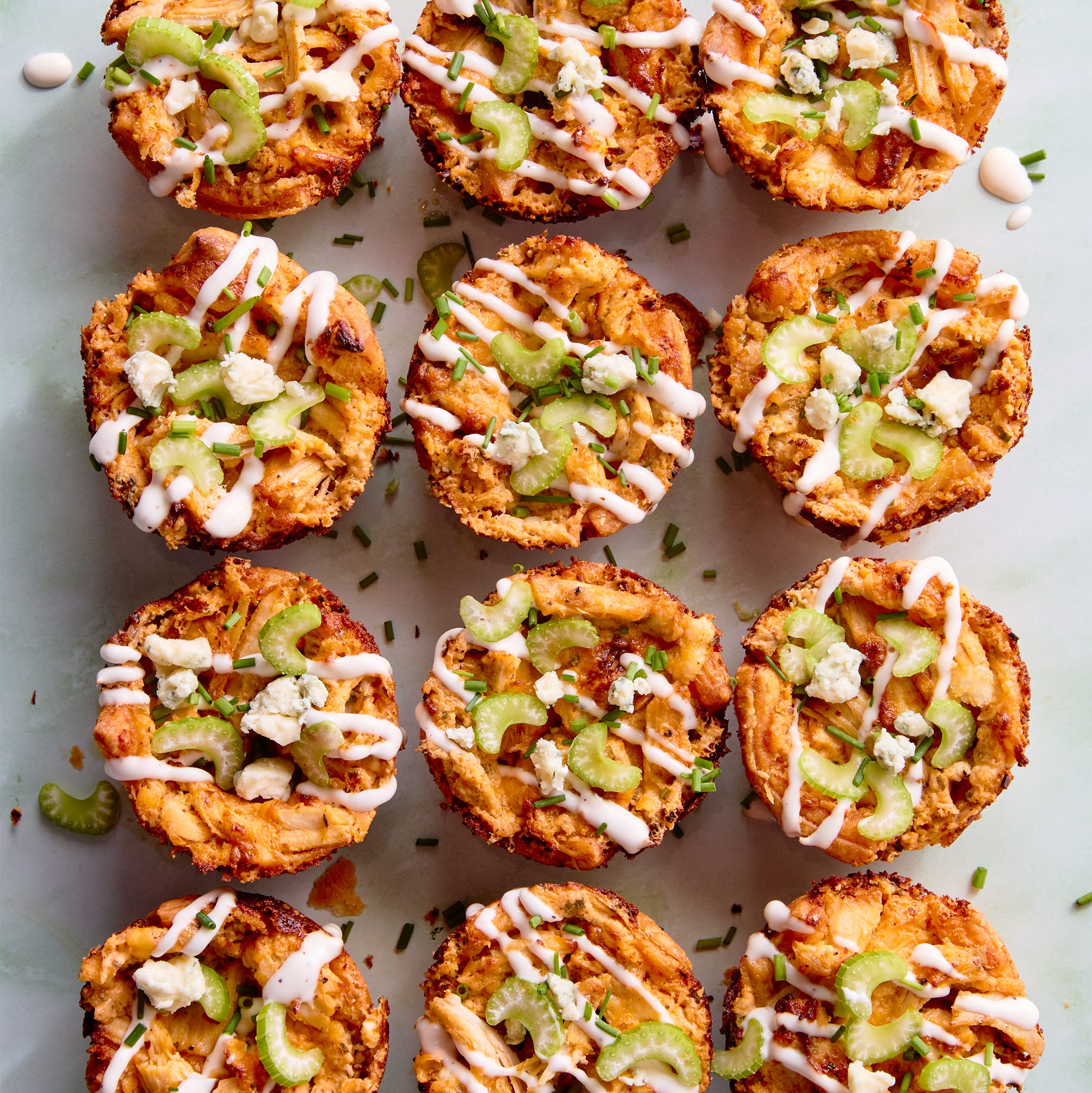 classic buffalo chicken dip with chopped chicken, cream cheese, cheddar, blue cheese, hot sauce, and chives baked into a crisp puff pastry shell until bubbling and golden