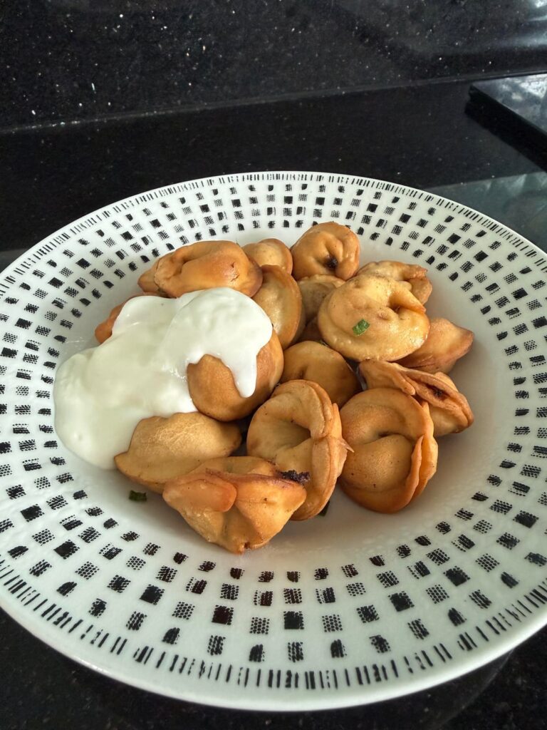 Russian ravioli (pelmeni). Homemade, fried with sour cream. I prefer fried more than boiled. And you?