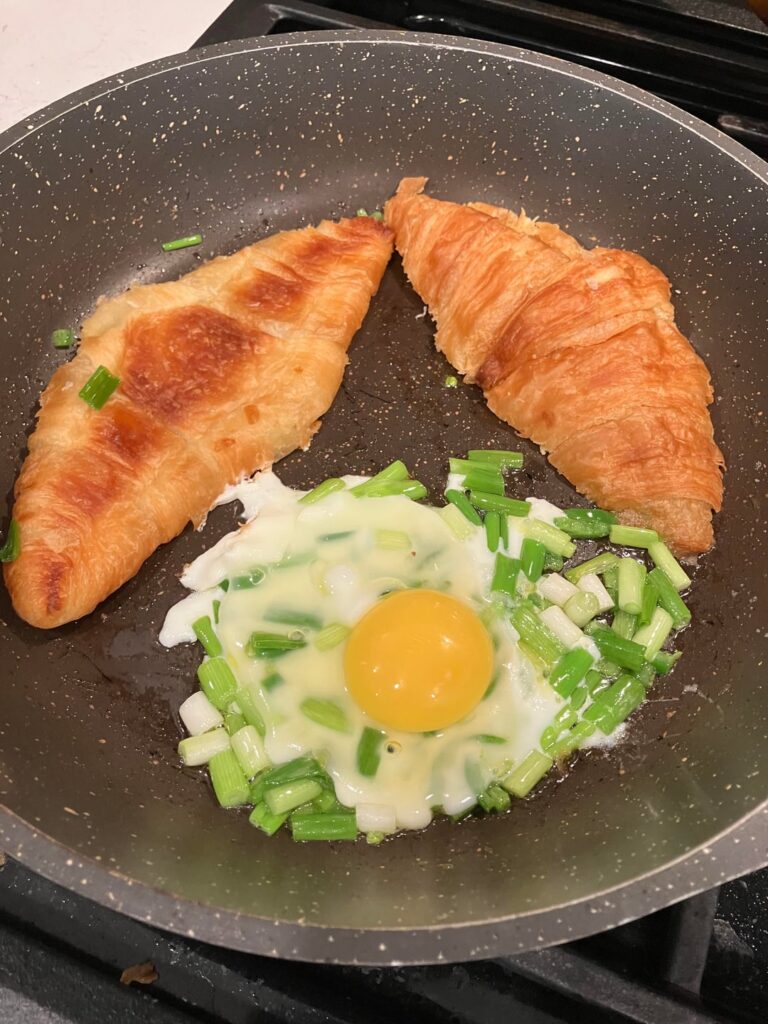 Croissant, egg, jalapeño, green onions.