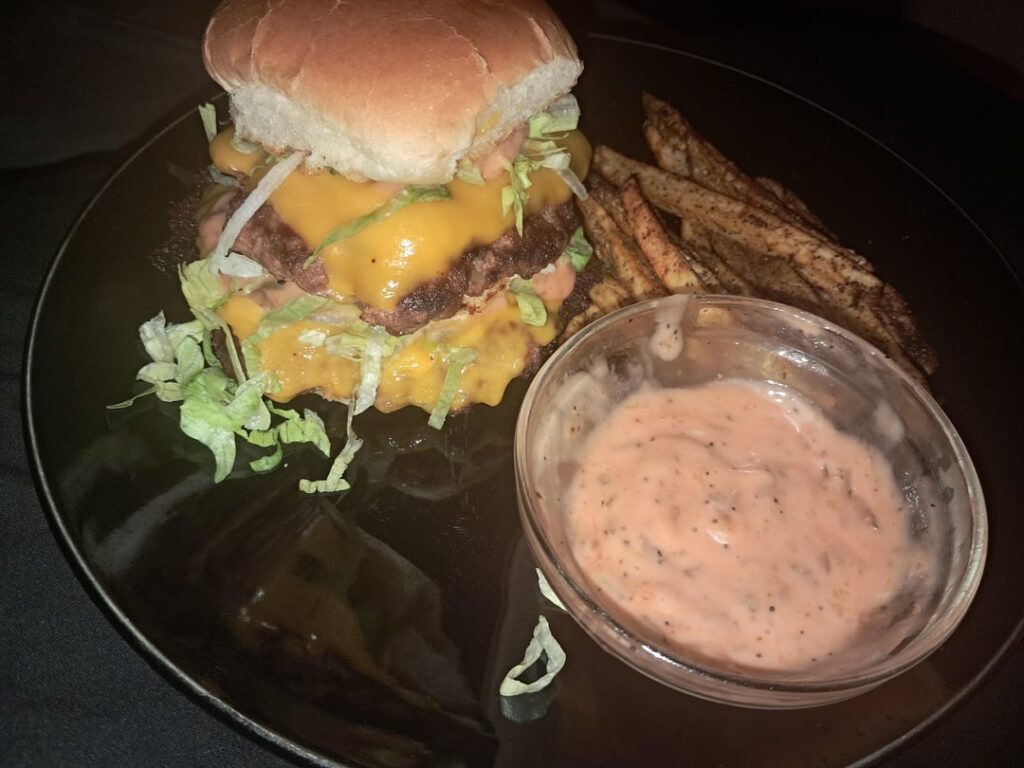 Double cheese burger with homemade fries and sauce