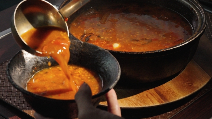 The Lost Recipe, a 200-year-old variation of Tom Yum once served as a royal delicacy in Siam, is reimagined by Chef Noom at Chim.