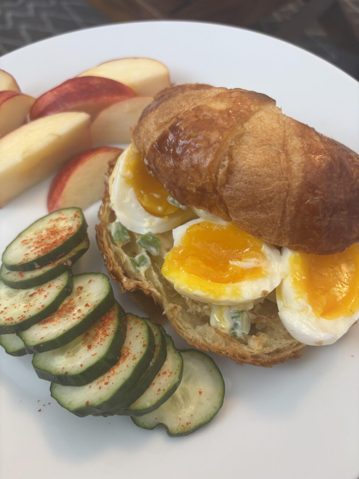 Toasted croissant with fresh jammy eggs.