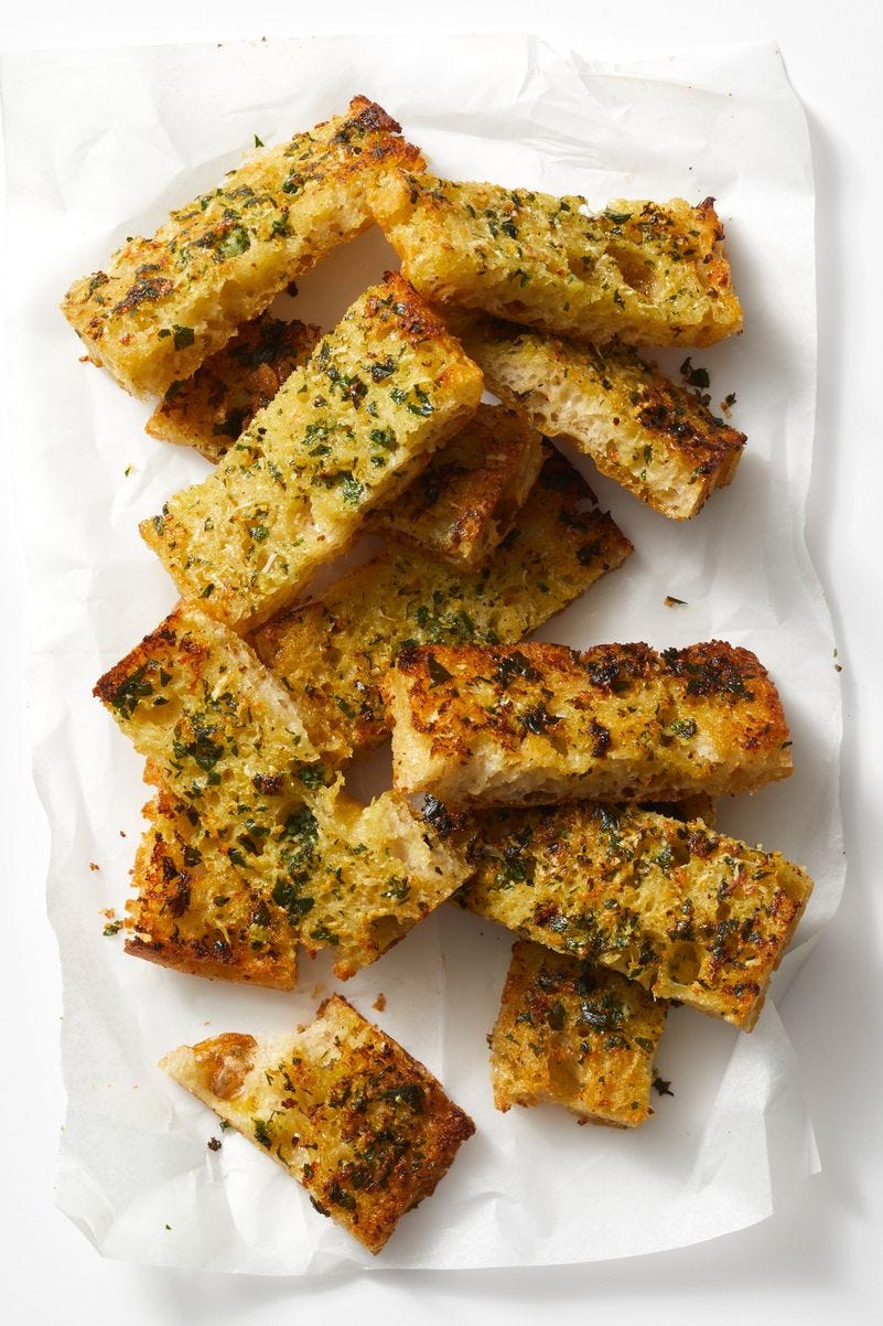 cheesy garlic bread on parchment paper