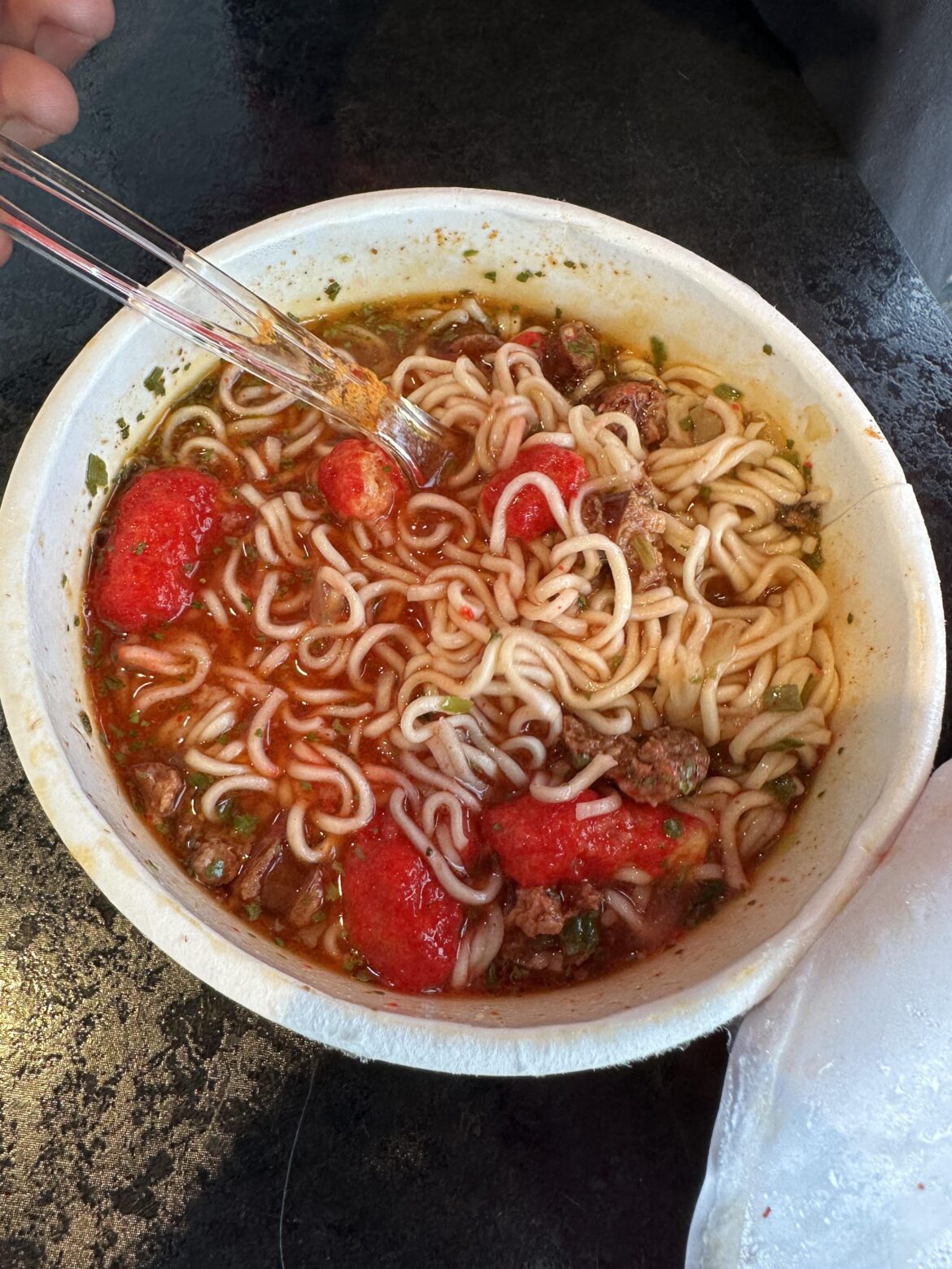 My coworker’s ramen with Slim Jim’s and Hot Cheeto Puffs
