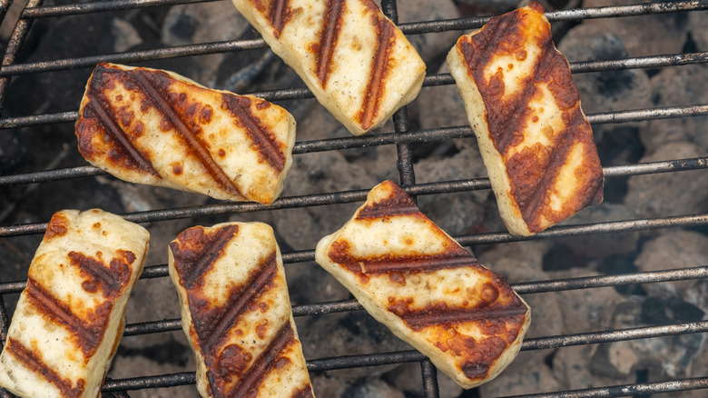 Some halloumi slices on a grill