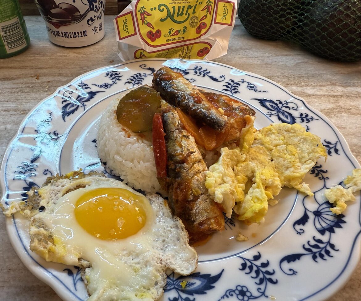 Nuri Spiced Sardines in tomato sauce over rice with eggs