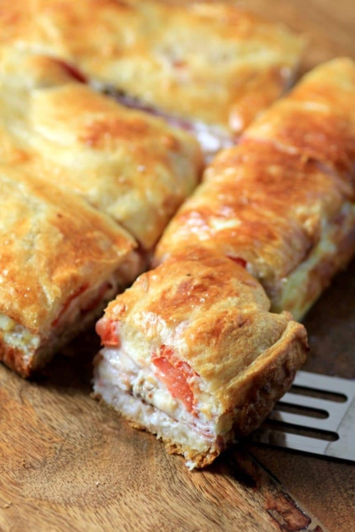 These 35 Scrumptious Make Ahead Brunch Casseroles will make your life over the holidays so much easier. Plus, everyone will be delighted with any one of these casseroles for the holidays. Hot sandwich on cutting board.