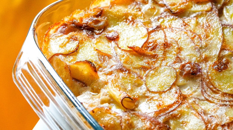 Close-up of potato au gratin in a glass casserole dish
