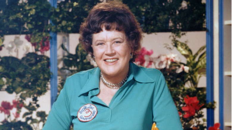Julia Child smiling in her kitchen