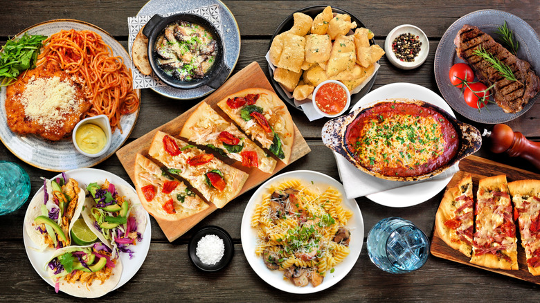 a spread of Italian American food on wood