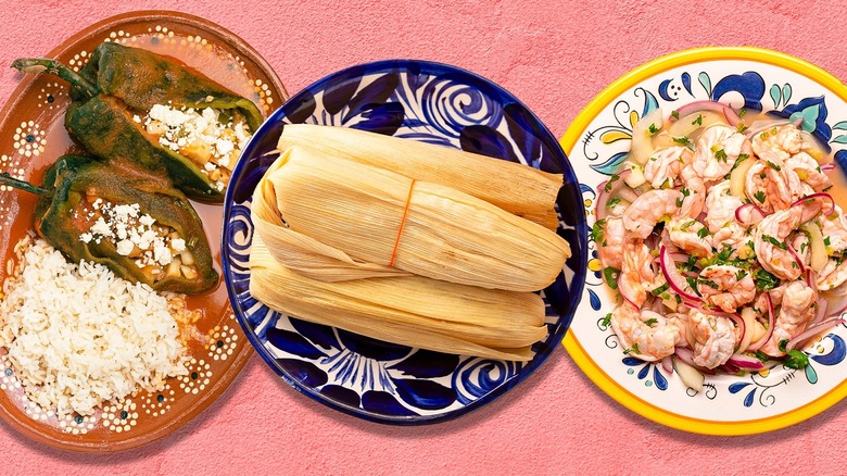 Three plates of Mexican food on pink background