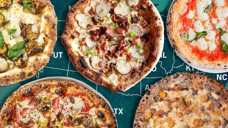 A selection of pizzas on top of a map showing U.S. states