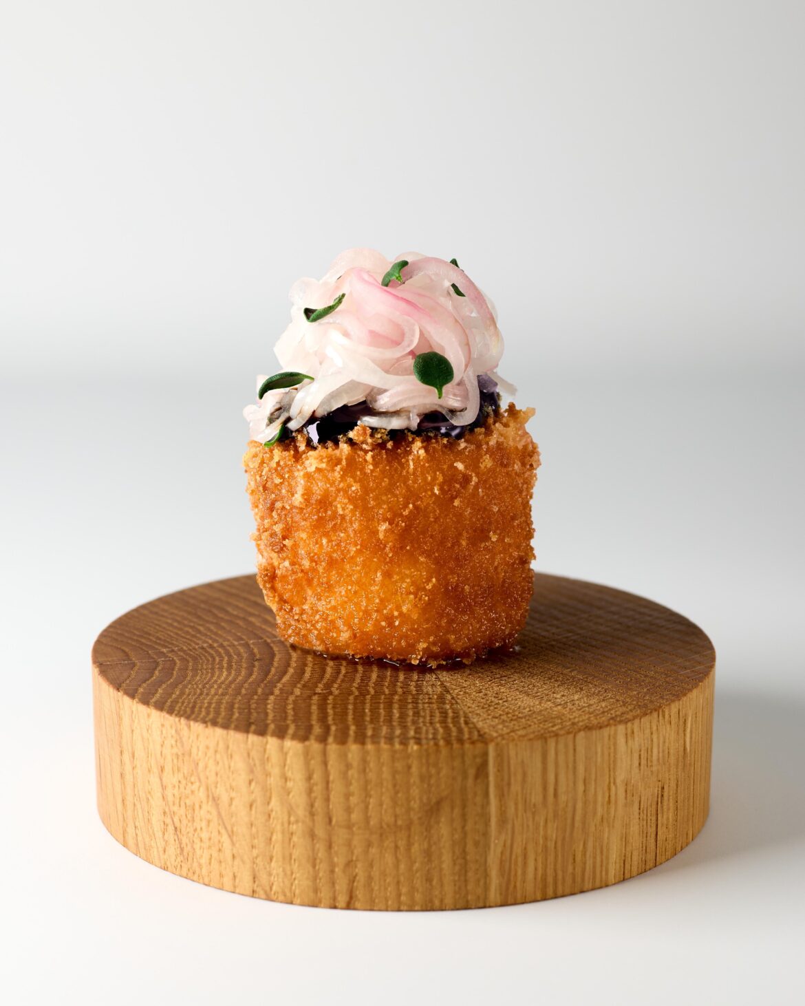 Amuse-bouche: Deep fried "Danbo Svart" cheese with blackberry–thyme gel and champagne pickled shallots