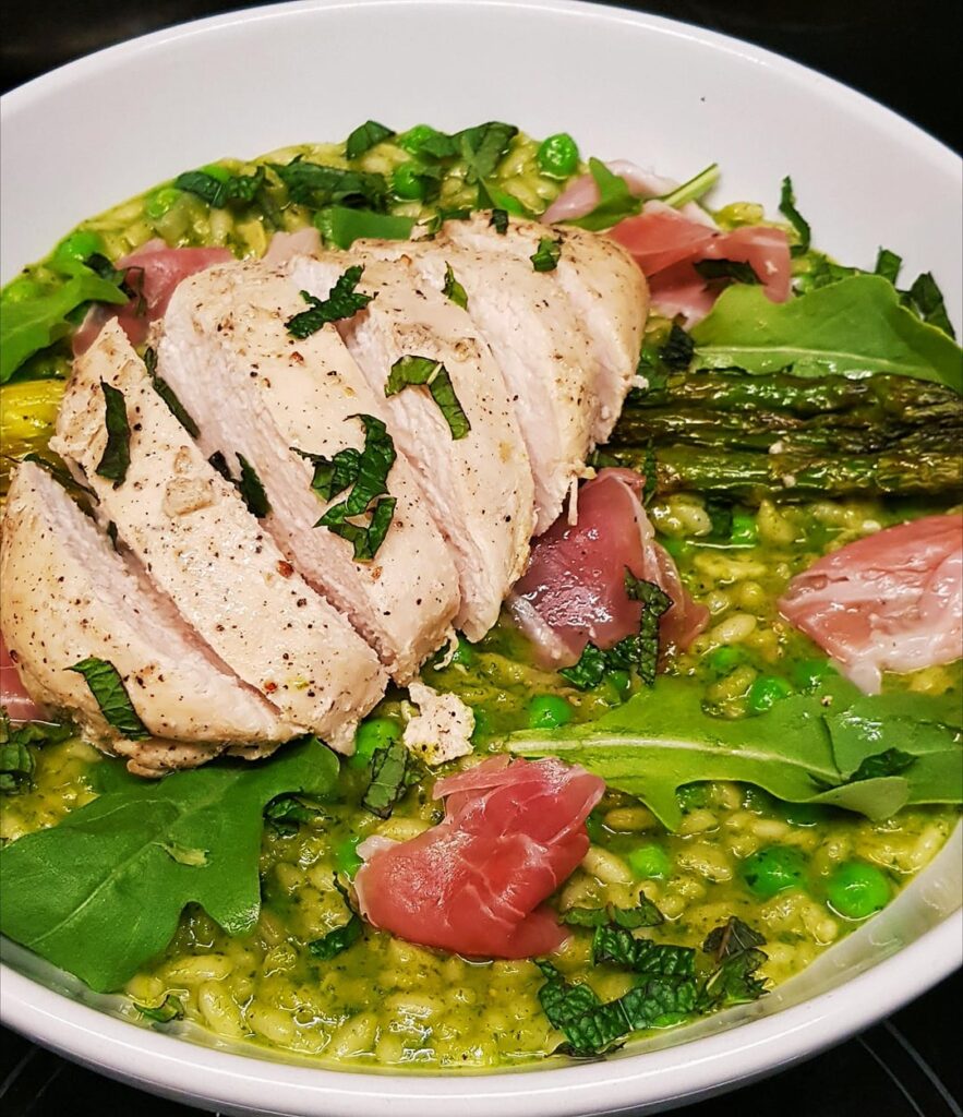 Sous Vide Chicken with Pea and Mint Risotto. Finished with Prosciutto and Rocket/Arugula and Parmesan.