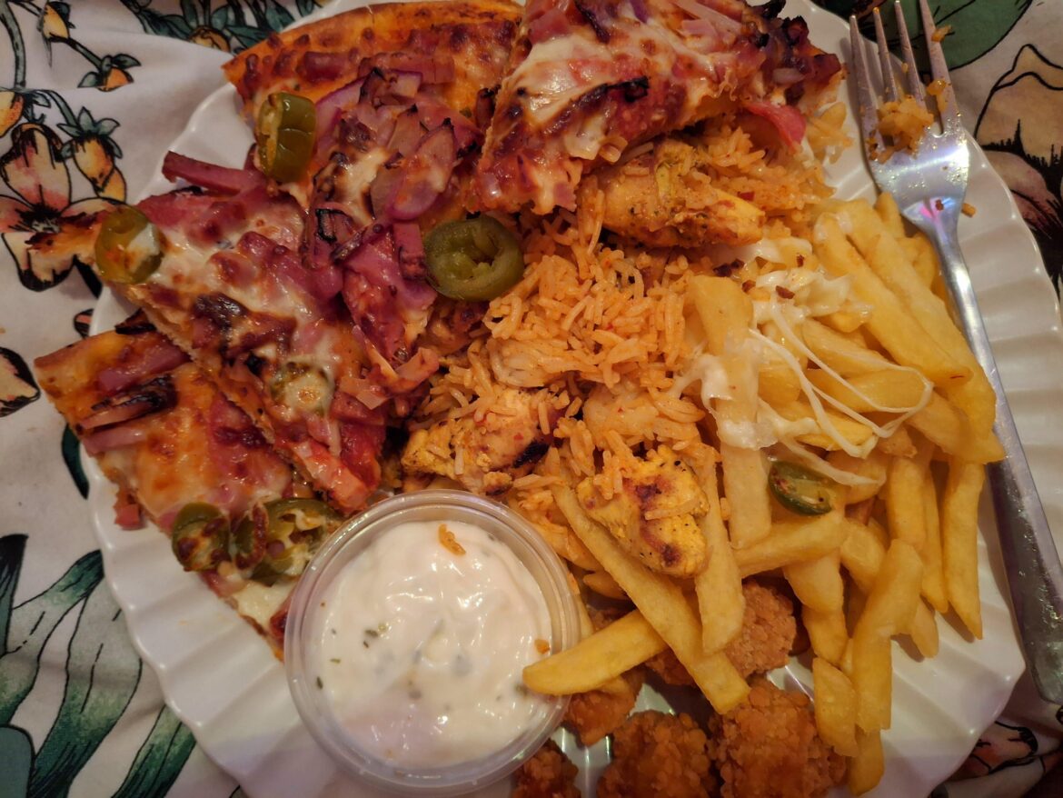 Bit of everything takeaway. Hot n spicy pizza, peri peri chicken and rice, cheese chips and popcorn chicken