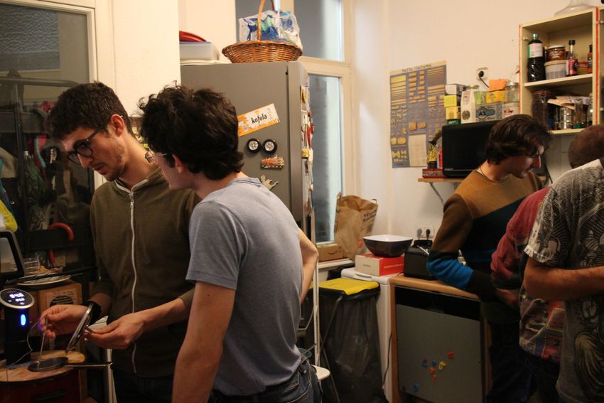 The researchers work together in one of their kitchens on their cacio e pepe experiments. The researchers work together in one of their kitchens on their cacio e pepe experiments.