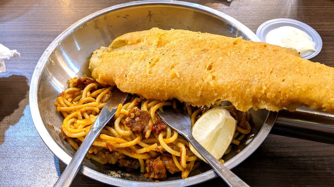 Where Did The Pairing Of Fried Fish And Spaghetti Originate?