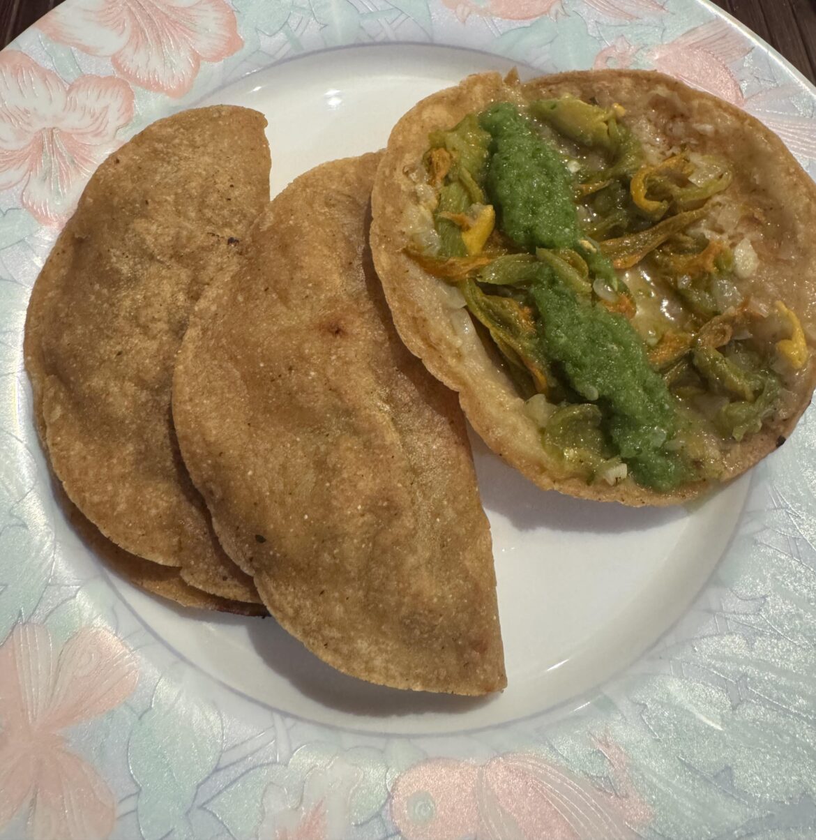 Homemade zucchini flower quesadillas (Mexico City style), with salsa verde cruda.