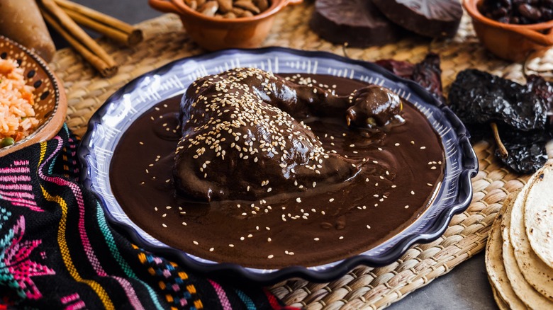 Mole poblano surrounded by ingredients