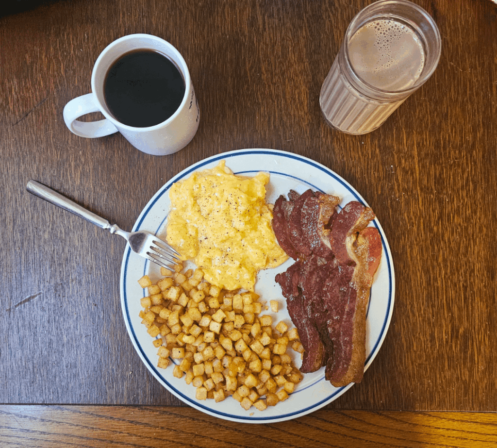 Scrambled eggs, breakfast taters, and bacon. One of my favorite meals to cook
