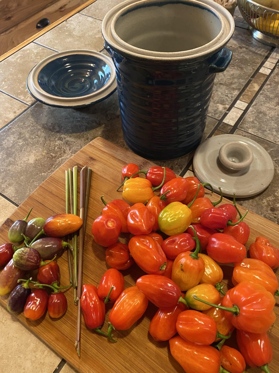 Anyone know what the purple/green/red peppers are in the left corner of the board?