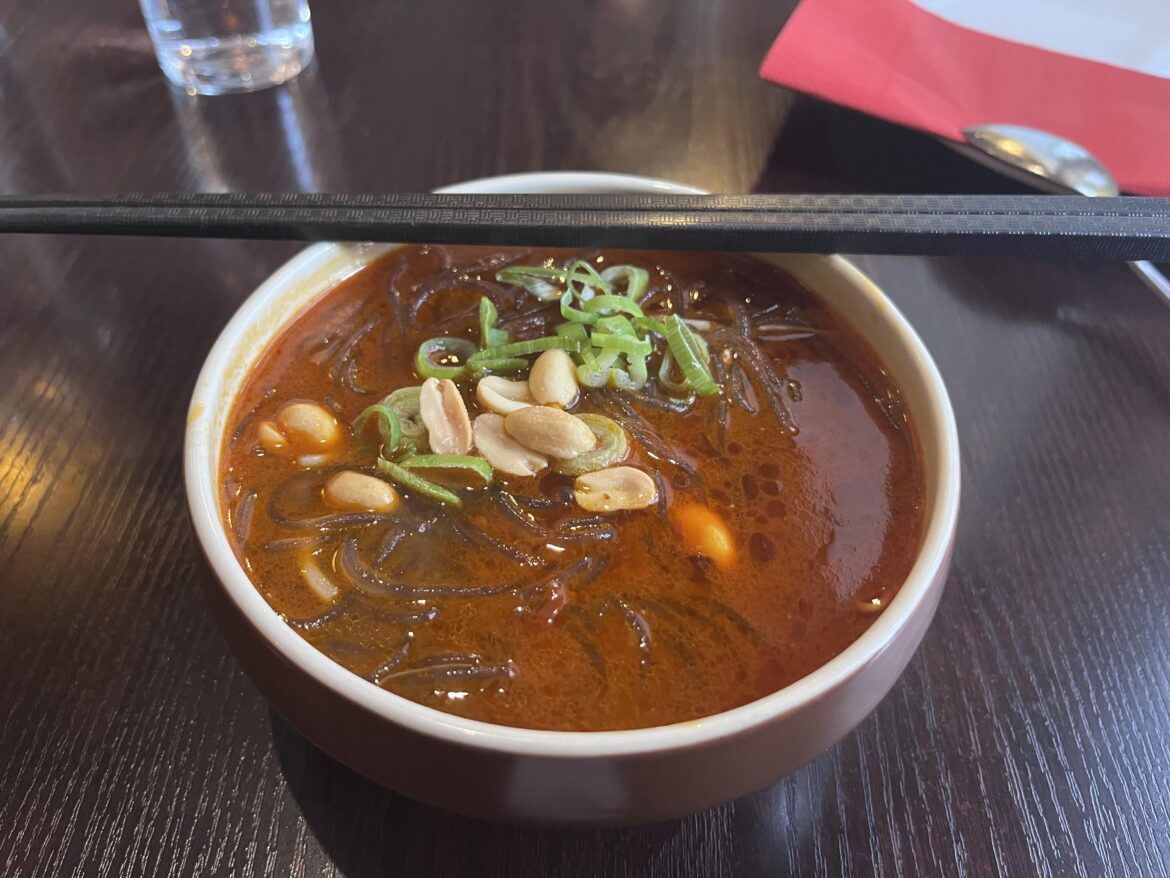 Sour and spicy chickens soup with sweet potato nudles