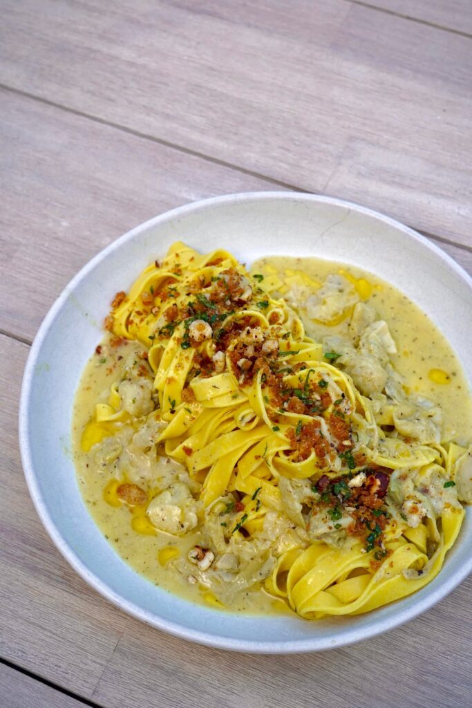 Fettuccine with cream of artichoke, and pangrattato. .