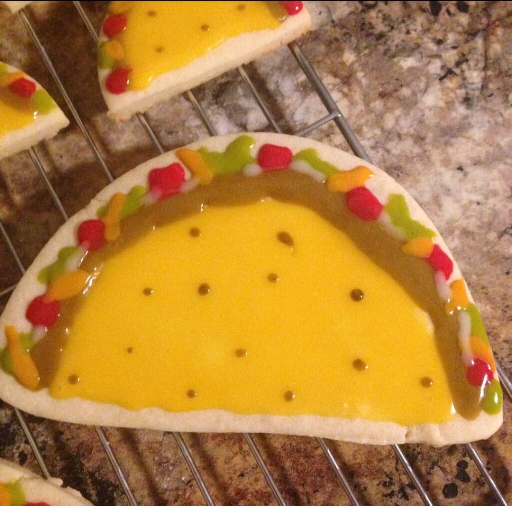 My son had a Dragon's Love Tacos birthday party so I had to make taco cookies! Made his cake as well. Such an awesome book!