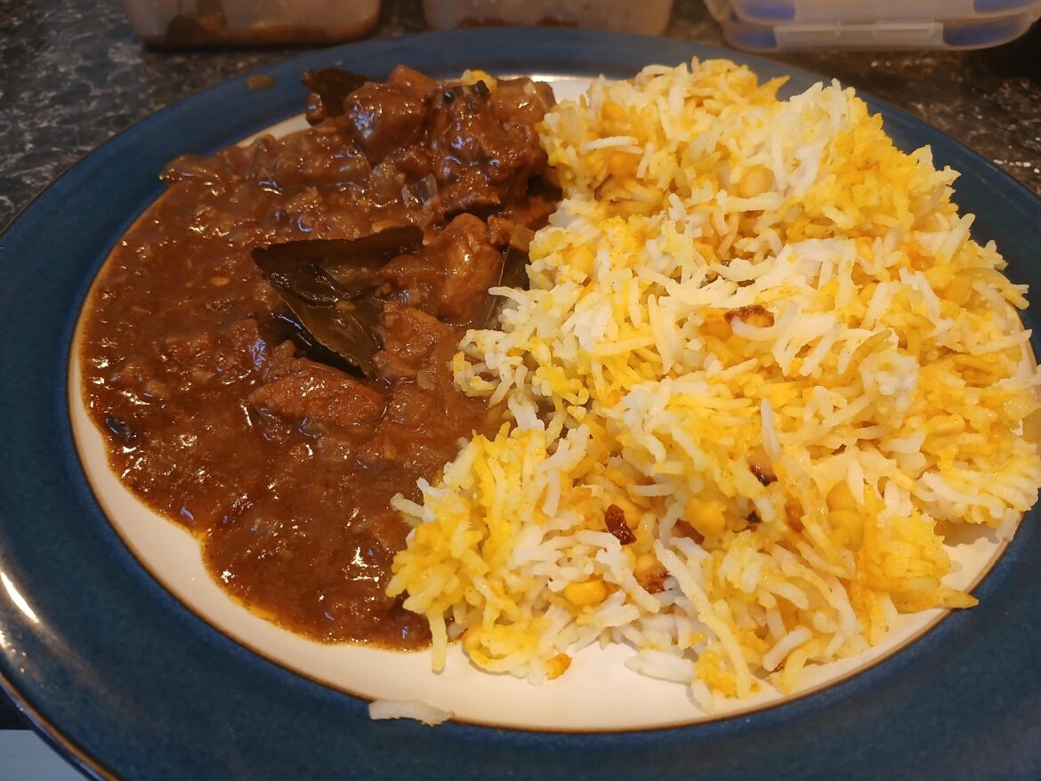 Pork vindaloo with lemon rice