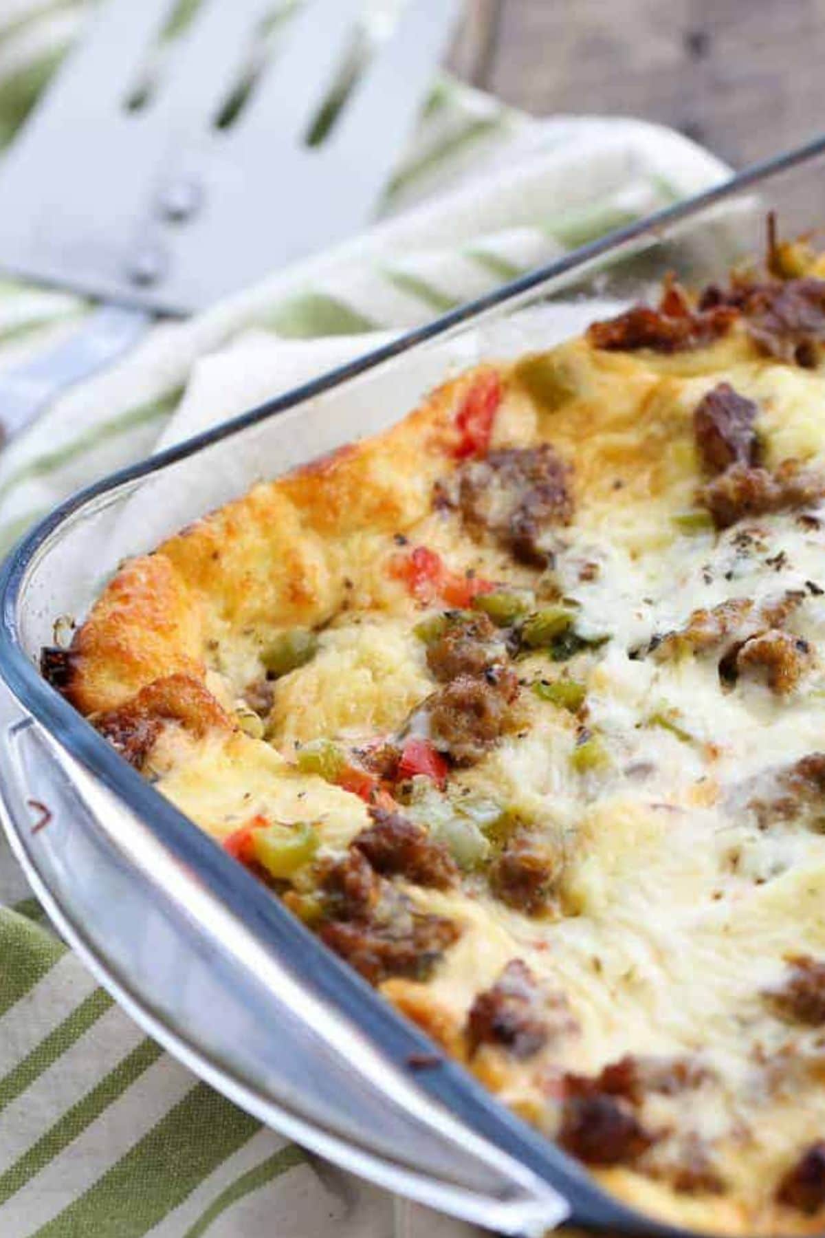 These 35 Scrumptious Make Ahead Brunch Casseroles will make your life over the holidays so much easier. Plus, everyone will be delighted with any one of these casseroles for the holidays. Sausage casserole in baking dish.