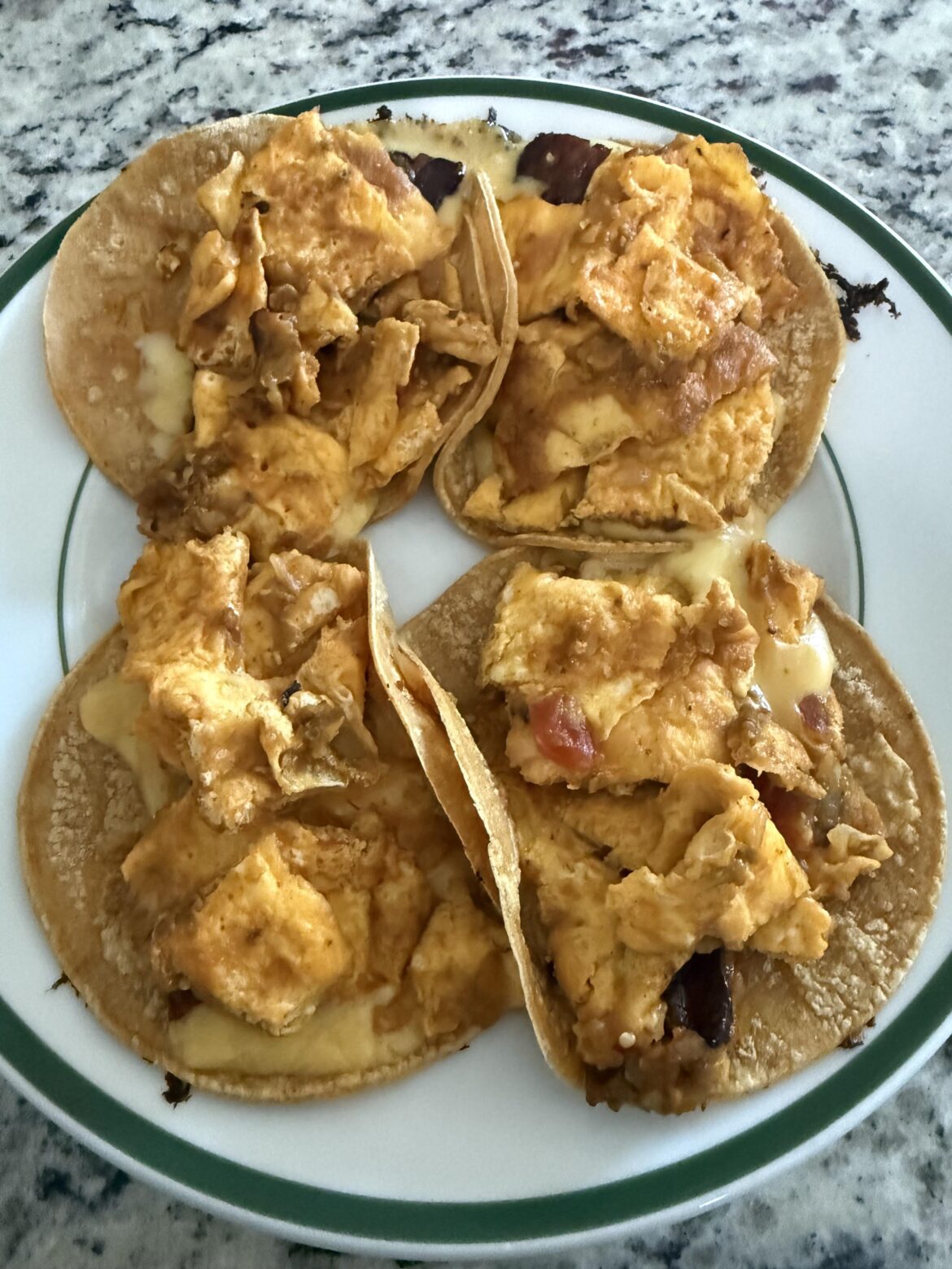 Breakfast tacos made with torta de huevo con chile, tocino, and queso ahumado. Breakfast tacos made with torta de huevo con chile, tocino, and queso ahumado.