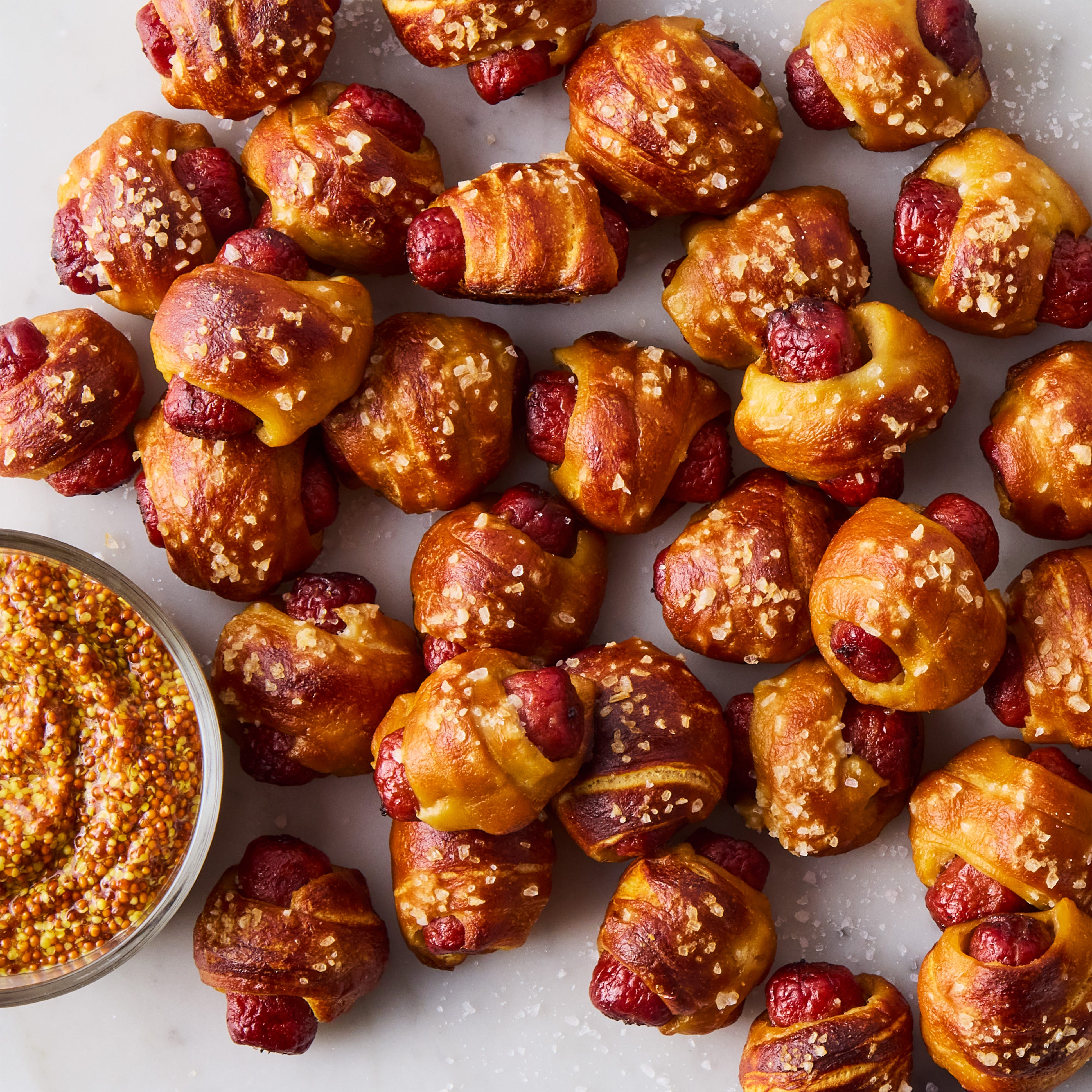 pigs in a blanket made with pretzeled dough